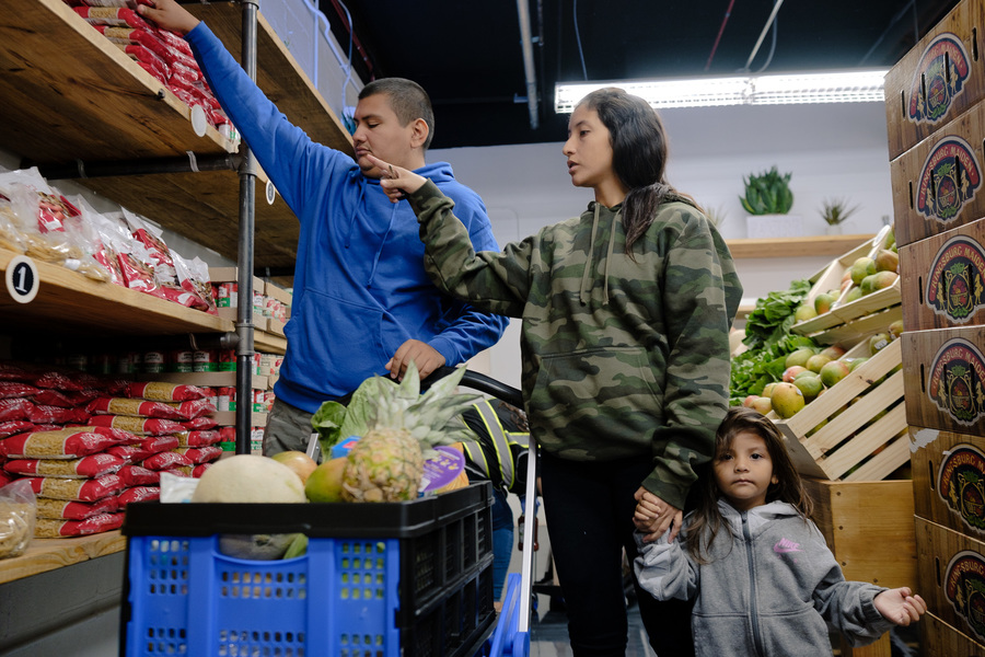 A family picking out food in a food pantry