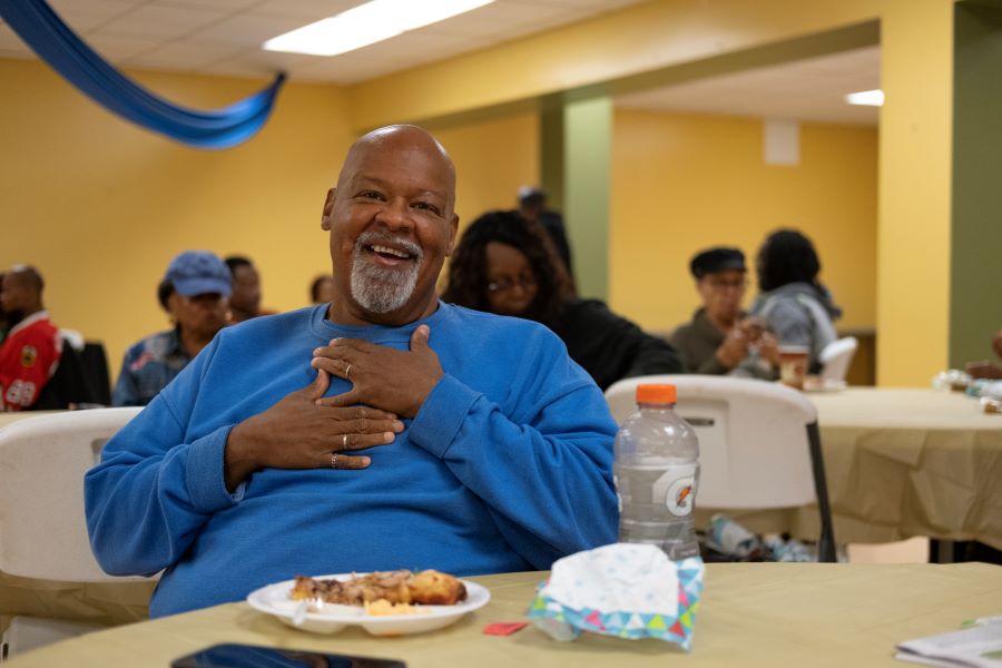 A community member enjoying a meal at the SEEDS Center pantry and soup kitchen.