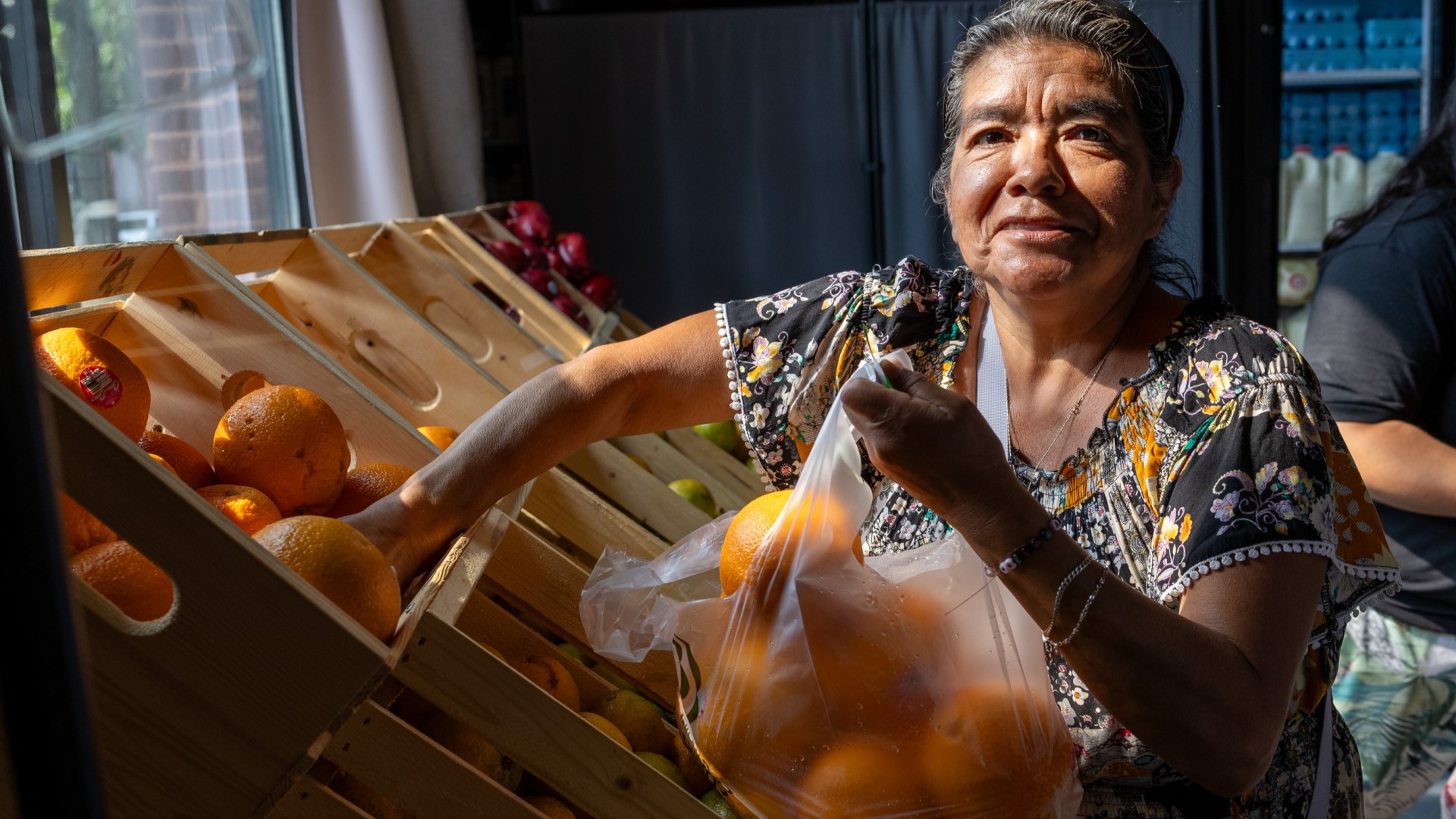 Woman shopping for organges